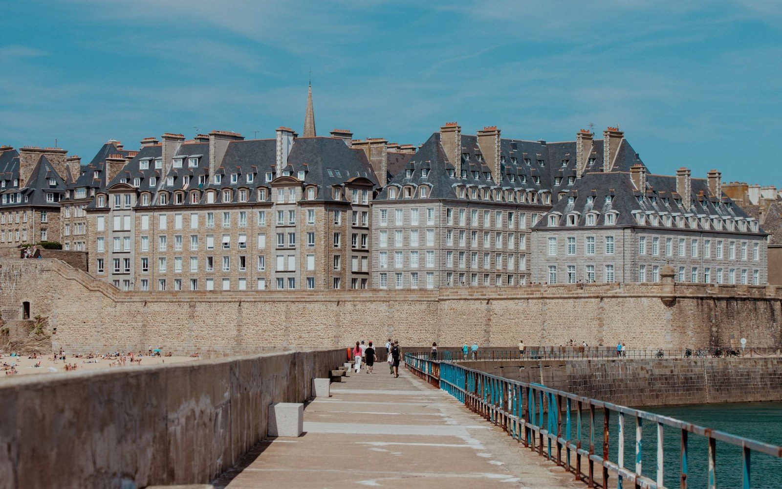 Walkway atop the ramparts leads toward the walled old town of Saint-Malo